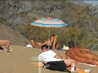 Slutwife tugging for cranks in a beach