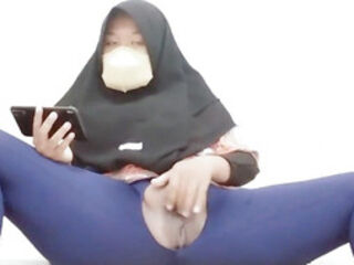 Indonesian hijab aunt wearing cucumber